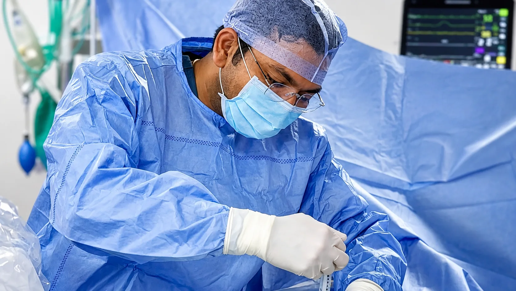 Dr. Achal Gupta performing Endoscopic Spine Surgery in the Operating Room